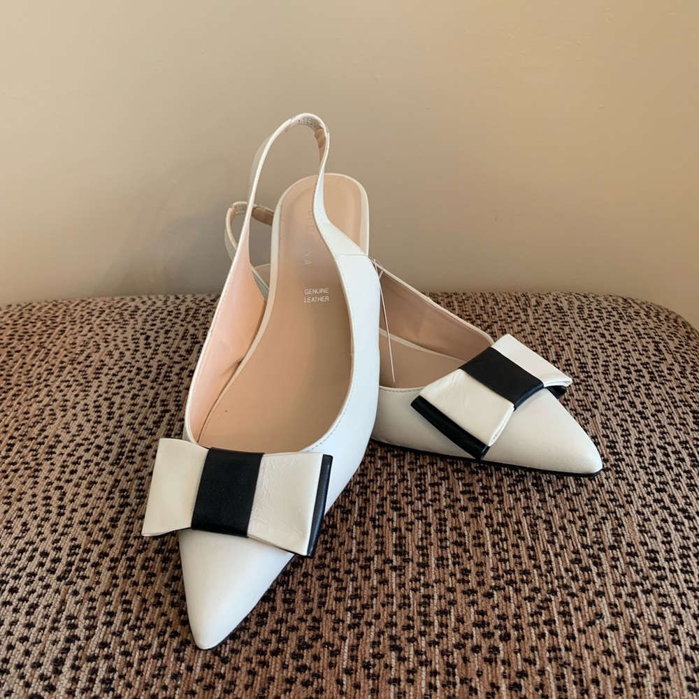 Chic White and Black Flats with Bow Detail